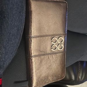 Coach metallic leather wallet. Roomy 12 slots for cards. Zipper compartment.